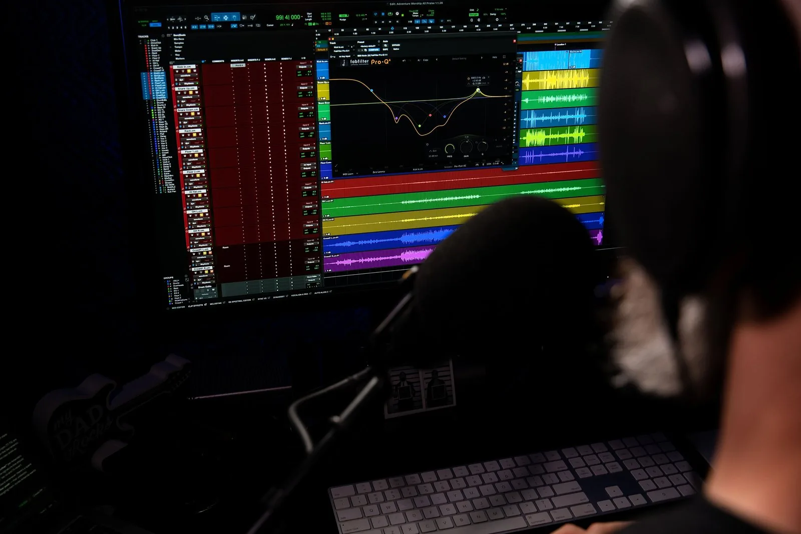 An open Pro Tools session with a full band mix in progress and an EQ curve on the kick